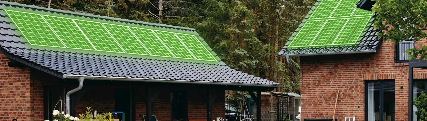 Häuser mit grün leuchtend digitalen PV Anlagen auf den Dächern